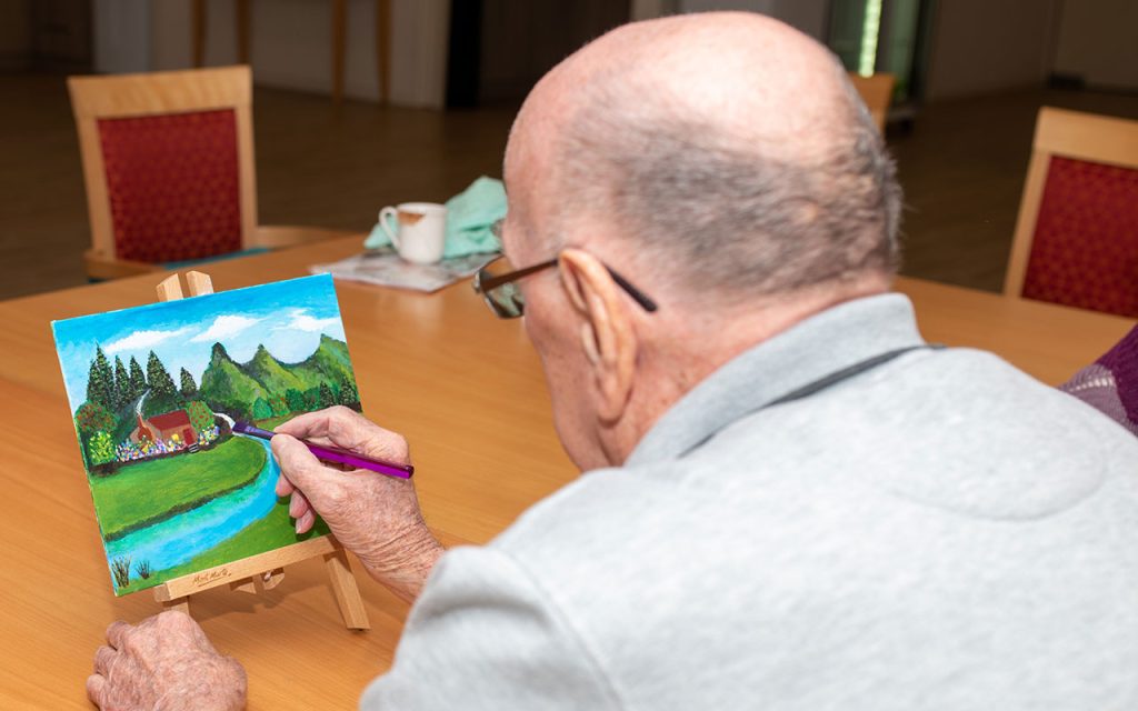 Ingenia Gardens Marsden resident with his work